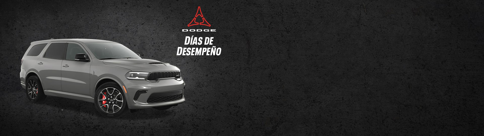 Ángulo delantero del lado del pasajero de un Dodge Durango SRT Hellcat 2024 gris. Eventos de ventas Días de desempeño.
