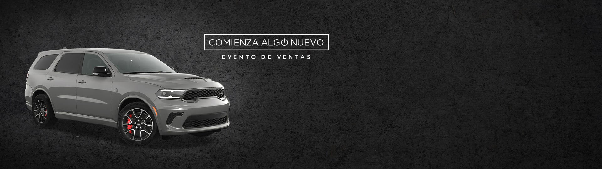 Ángulo delantero del lado del pasajero de un Dodge Durango SRT Hellcat 2024 gris. Evento de ventas “Comienza algo nuevo”.