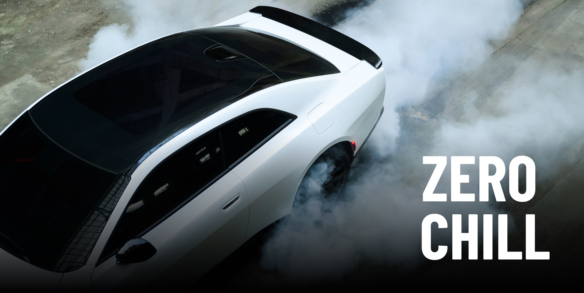 A white 2027 Dodge Charger Scat Pack with glass roof, surrounded by smoke billowing from its tires, shot from overhead. Zero Chill.