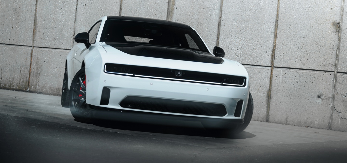 A white 2027 Dodge Charger Daytona Scat Pack with a black hood insert.