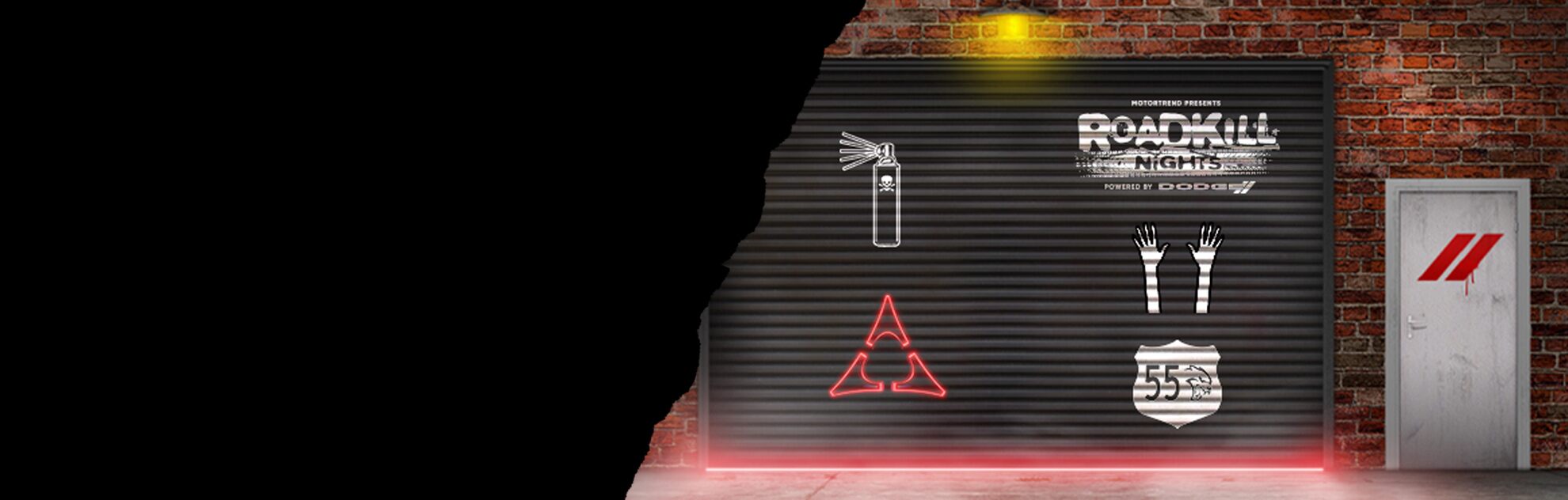 A black folding garage door on an old brick building at night, with red light emanating underneath. Graffiti is painted on the door: a white spray paint can with skull and crossbones, MotorTrend presents Roadkill Nights powered by Dodge in white, a set of white raised hands, the Fratzog logo in red and a white badge with 55 and the Hellcat head on it. The white dingy-looking door next to it has the Dodge red racing stripes spray painted on it.